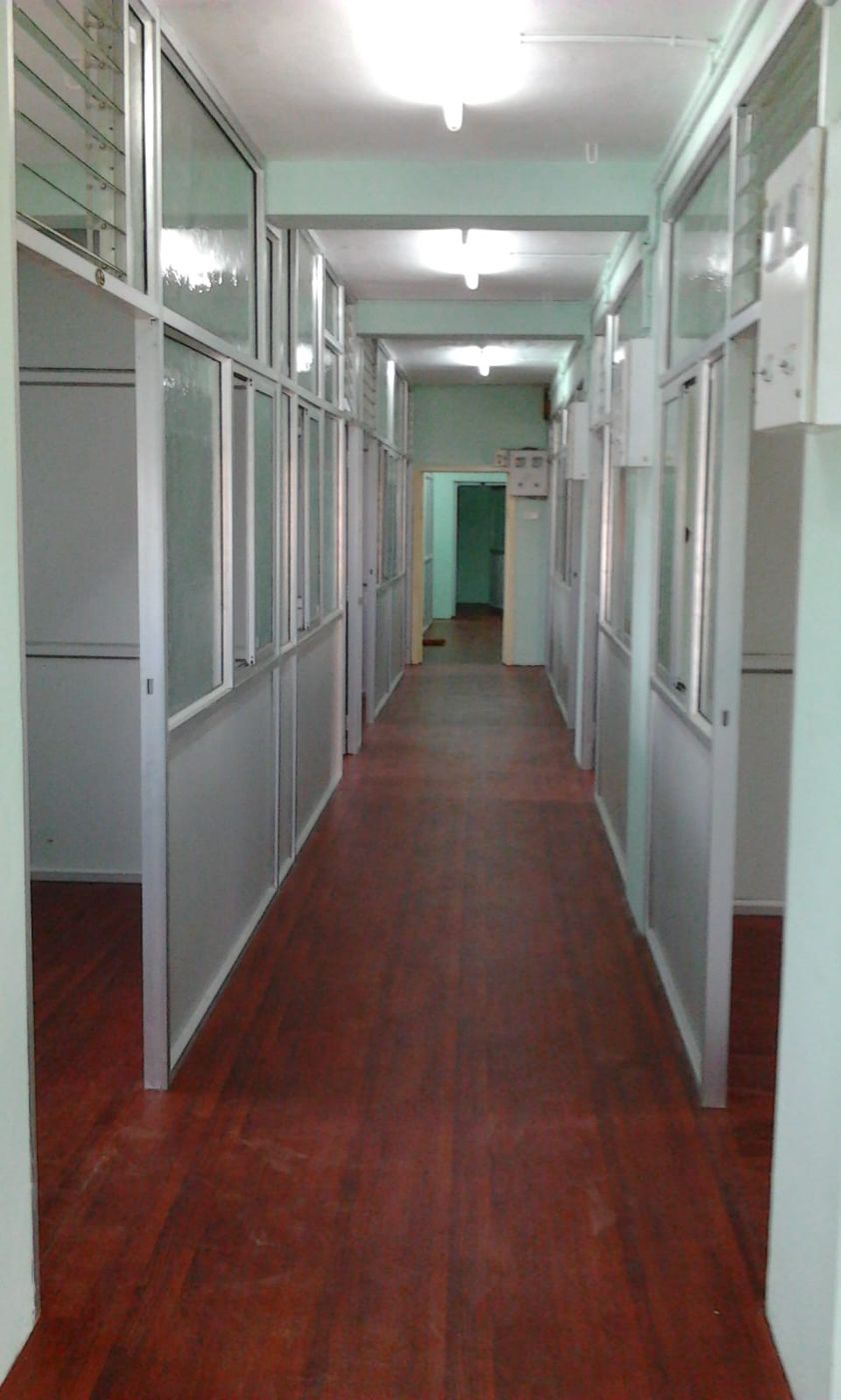 Corridor between partitioned rooms