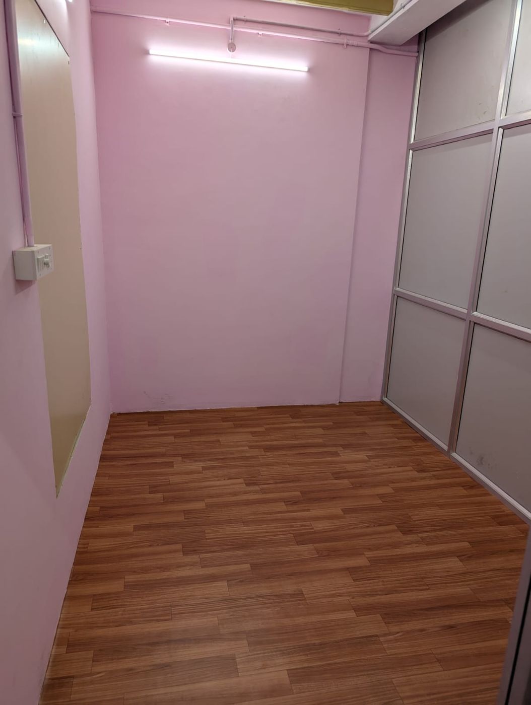 Narrow room with a switchboard and partition panels
